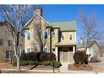 Charming two-story home with stone accents, mature landscaping and covered front entry at 3769 Baxley Point Dr, Suwanee, GA 30024