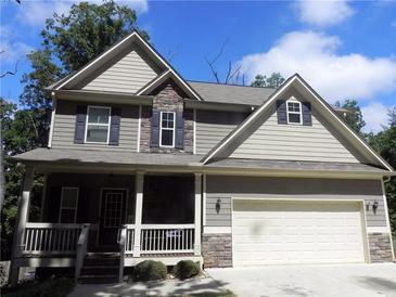 Charming two-story home with stone accents, a covered porch, and an attached two car garage at 1101 Senator Rd, Douglasville, GA 30134