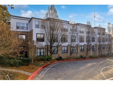 A multi-story condominium building featuring neutral colors and large windows offering ample natural light at 821 Ralph Mcgill Ne Blvd # 3104, Atlanta, GA 30306