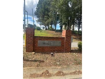 Exterior view of Windygate Townhomes sign at 5768 Windgate Ln, Lithonia, GA 30058