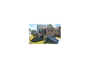 Two story home with well maintained lawn, grey siding, and dark shutters at 6048 Prodigy Ln, Locust Grove, GA 30248
