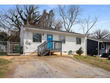 Charming single-story home featuring a blue front door and well-maintained landscaping at 17 Turman #4 Se Ave, Atlanta, GA 30315