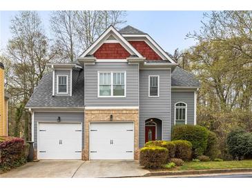 Charming two-story home with a two car garage and attractive architectural details at 1363 Summer Lane Se Dr, Atlanta, GA 30316