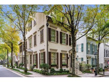 Charming two-story home featuring symmetrical design, window boxes and manicured landscaping at 301 Abercorn Sq, Peachtree City, GA 30269