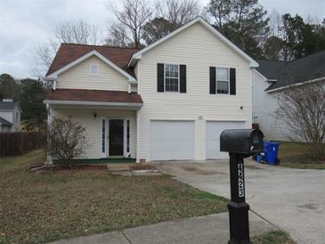 Charming two-story home with a two-car garage and neutral siding, perfect for a growing Gathering at 4423 Gladewood Run, Union City, GA 30291