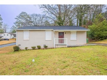 Charming single-story home featuring a brick exterior and a well-maintained lawn at 285 Argus Nw Cir, Atlanta, GA 30331