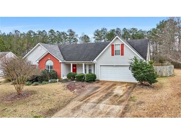 Charming single-Gathering home featuring a two-car garage and a well-manicured front yard at 40 Berkshire Run, Covington, GA 30016