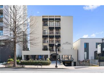 Modern condo building exterior with clean lines and black awnings in an urban setting at 1421 Peachtree Ne St # 310, Atlanta, GA 30309