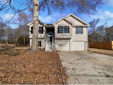 Charming two-story home with double garage and inviting front entrance at 99 Cedars Glen Way, Villa Rica, GA 30180