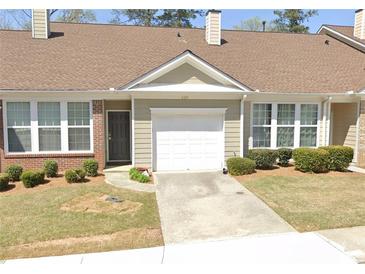 Charming single-story home with a one-car garage and nicely landscaped front yard at 420 Copeland St, Grayson, GA 30017