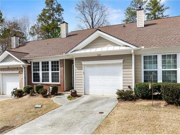 Charming single-story home featuring a one-car garage, manicured shrubs, and an inviting front entrance at 420 Copeland St, Grayson, GA 30017