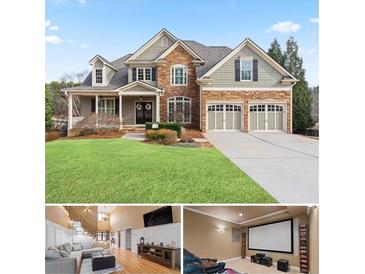 Charming two-story home with stone accents, a manicured lawn, and a two-car garage at 3130 Kates Nw Way, Kennesaw, GA 30152