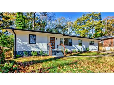 Charming one-story home with modern updates and a freshly landscaped front yard at 2047 Seavey Dr, Decatur, GA 30032