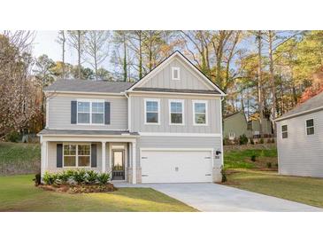 Charming two-story home featuring a traditional design, well-manicured landscaping, and an attached two-car garage at 4098 Fairlady Ct, Kennesaw, GA 30144