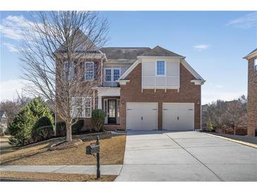 Charming brick two-story home featuring a two-car garage and well-manicured front yard at 4669 Prater Se Way, Smyrna, GA 30080