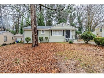 Charming one-story home with manicured lawn and mature trees providing shade and curb appeal at 1850 Brewer Sw Blvd, Atlanta, GA 30310