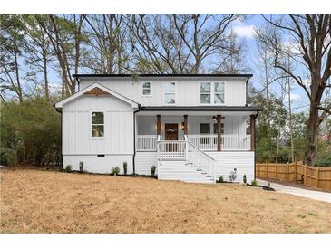 Charming two-story home with a welcoming front porch and manicured lawn at 770 Waters Sw Dr, Atlanta, GA 30310