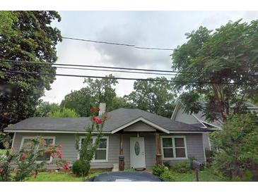 Charming one-story home featuring a covered porch, well-maintained lawn, and inviting curb appeal at 1268 Wylie Se St, Atlanta, GA 30317