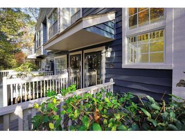 Inviting front entrance with a covered porch and blue siding at 1482 N Crossing Ne Cir, Atlanta, GA 30329