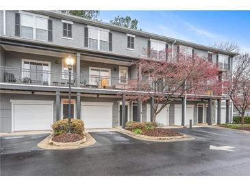 Charming condo building featuring a well-maintained facade, private balconies and convenient garage parking at 100 Brickworks Ne Cir # 104, Atlanta, GA 30307