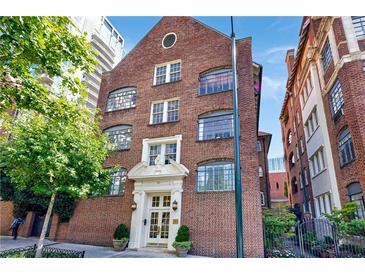 Stately brick building showcasing traditional architecture and lush greenery enhancing curb appeal at 93 Peachtree Ne Pl # 5, Atlanta, GA 30309