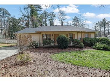 Charming single-story home with well-maintained landscaping and inviting curb appeal at 921 Forest Park Ln, Suwanee, GA 30024