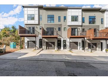 Modern townhome exterior featuring private balconies, garage spaces, and contemporary architectural design at 2333 Mason Dr # D26, Atlanta, GA 30316