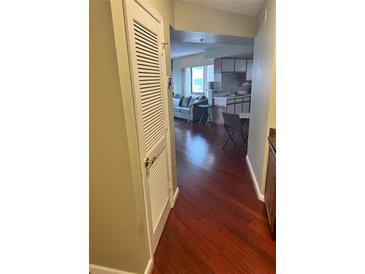 A comfortable living area with hardwood flooring, a gray sofa, and natural light at 795 Hammond Dr # 1712, Atlanta, GA 30328