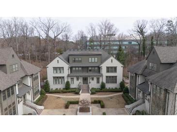 Beautiful exterior elevation of townhouse with manicured landscaping and inviting entrance at 6711 Cadence Blvd, Atlanta, GA 30328