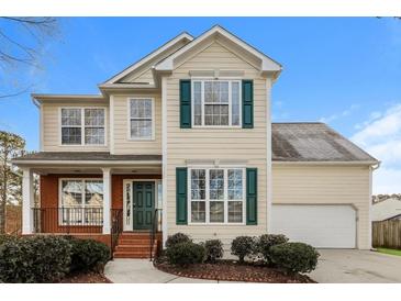 Charming two-story home with a manicured lawn and inviting entrance at 8542 Lakemeadow Dr, Union City, GA 30291