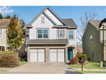 Charming two-story home with a two-car garage, beautiful landscaping, and inviting curb appeal at 5835 Sterling Ct, Cumming, GA 30040