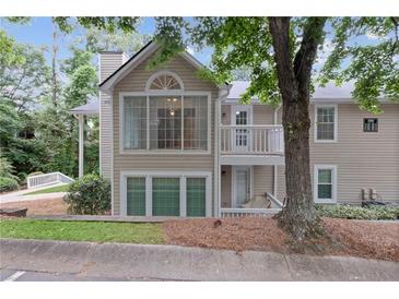 Inviting two-story condo with charming balcony and well-maintained landscaping at 1905 Countryside Se Pl # 1905, Smyrna, GA 30080