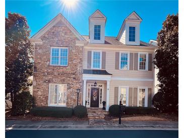 Charming two-story home featuring a stone facade and dormer windows, plus a welcoming front porch at 1580 Reids Ferry Way, Marietta, GA 30062