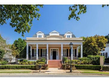 Charming home featuring a welcoming front porch, dormer windows and professionally landscaped yard at 3786 Turnberry Ct, Duluth, GA 30096