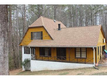 Charming two-story home with inviting covered porch and traditional architectural details at 110 Casa Domain Ct, South Fulton, GA 30349