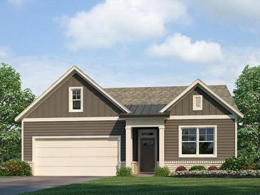 Charming single-story home with gray siding, white trim, a two-car garage, and manicured landscaping at 76 Lakeview Pt, Dallas, GA 30157