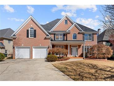 Stunning brick home with a three car garage and beautifully manicured lawn at 1688 Kenbrook Nw Trce, Acworth, GA 30101