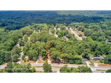 An aerial view of wooded homesite surrounded by mature trees at 1491 S Hairston Rd, Stone Mountain, GA 30088