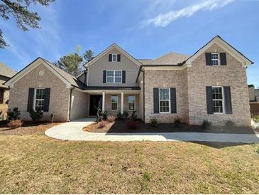 Charming brick home featuring symmetrical windows and a welcoming front entrance at 7260 Bluewater Ln, Douglasville, GA 30135