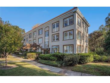 Charming exterior view of a multi-story condo building with manicured landscaping and inviting curb appeal at 3 Park Ne Ln # H, Atlanta, GA 30309
