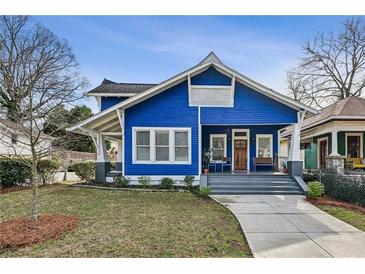 Charming blue craftsman home with a welcoming front porch and well-maintained landscaping at 726 Brookline Sw St, Atlanta, GA 30310