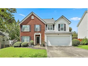 Charming two-story home with a well-manicured lawn and a two-car garage in a great neighborhood at 2726 Northgate Nw Way, Acworth, GA 30101