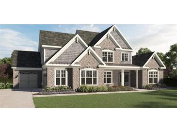 Charming two-story home showcasing a brick facade, well-manicured lawn, and inviting covered porch at 1106 Low Water Nw Xing, Acworth, GA 30101