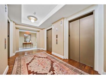 Hallway decorated with rug and leading to the elevator at 3630 Peachtree Ne Rd # 1809, Atlanta, GA 30326