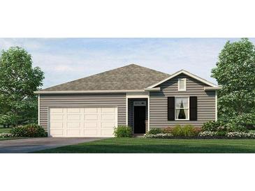 Charming one-story home featuring a two-car garage, landscaped yard, and neutral siding at 8603 Secretariat Dr, Lithonia, GA 30058
