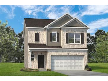 Charming two-story home with a brick facade and attached two-car garage at 720 Shetland Trl, Cartersville, GA 30121