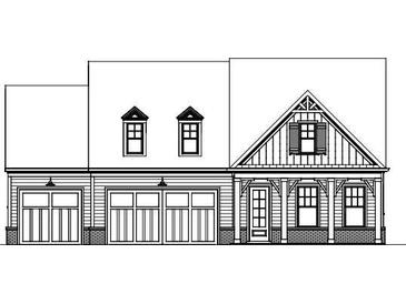 Traditional-style home featuring a front-facing, two-car garage and covered front porch at 1311 Lakeside Overlook, Canton, GA 30114