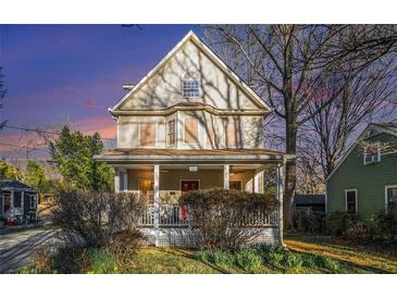 Charming two-story home featuring a welcoming front porch and classic architectural details at 436 Avery St, Decatur, GA 30030