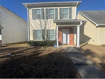 Charming two-story home with a well-maintained front yard and inviting entryway at 6120 Ruth St, Covington, GA 30014