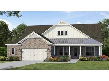Charming single-story home with a brick facade, covered porch, and well-manicured lawn at 345 Brooke View Trl, Canton, GA 30115